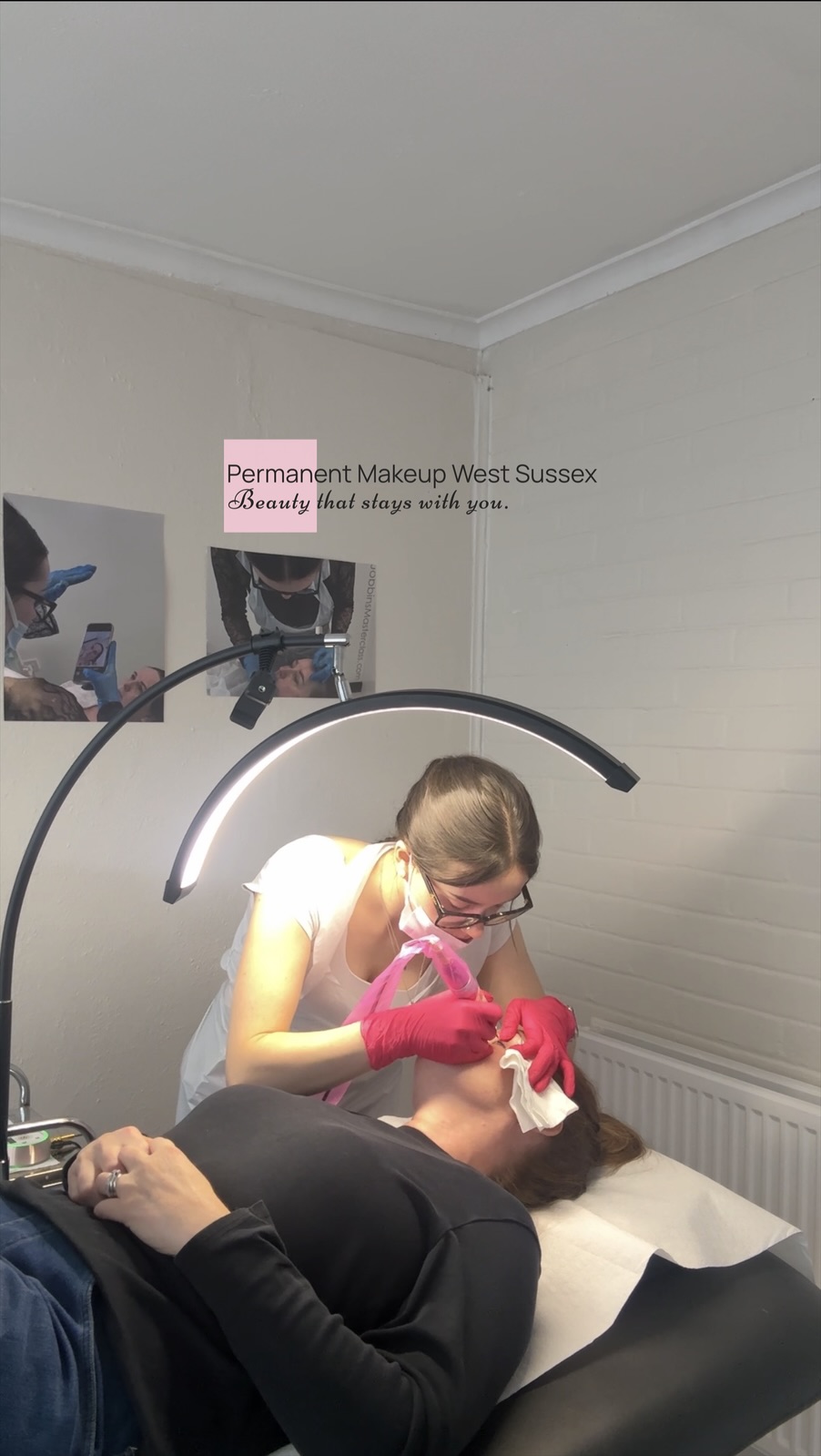 Natalia carrying out a permanent makeup treatment on a client in the studio